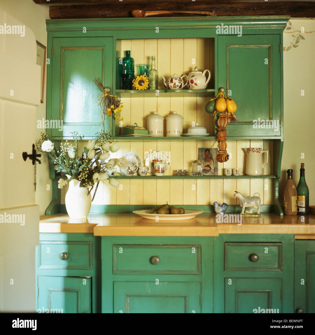 Close-up of fitted turquoise-green dresser in cream cottage kitchen Stock Photo - Alamy Close-up of fitted turquoise-green dresser in cream cottage kitchen Stock Photo - Alamy