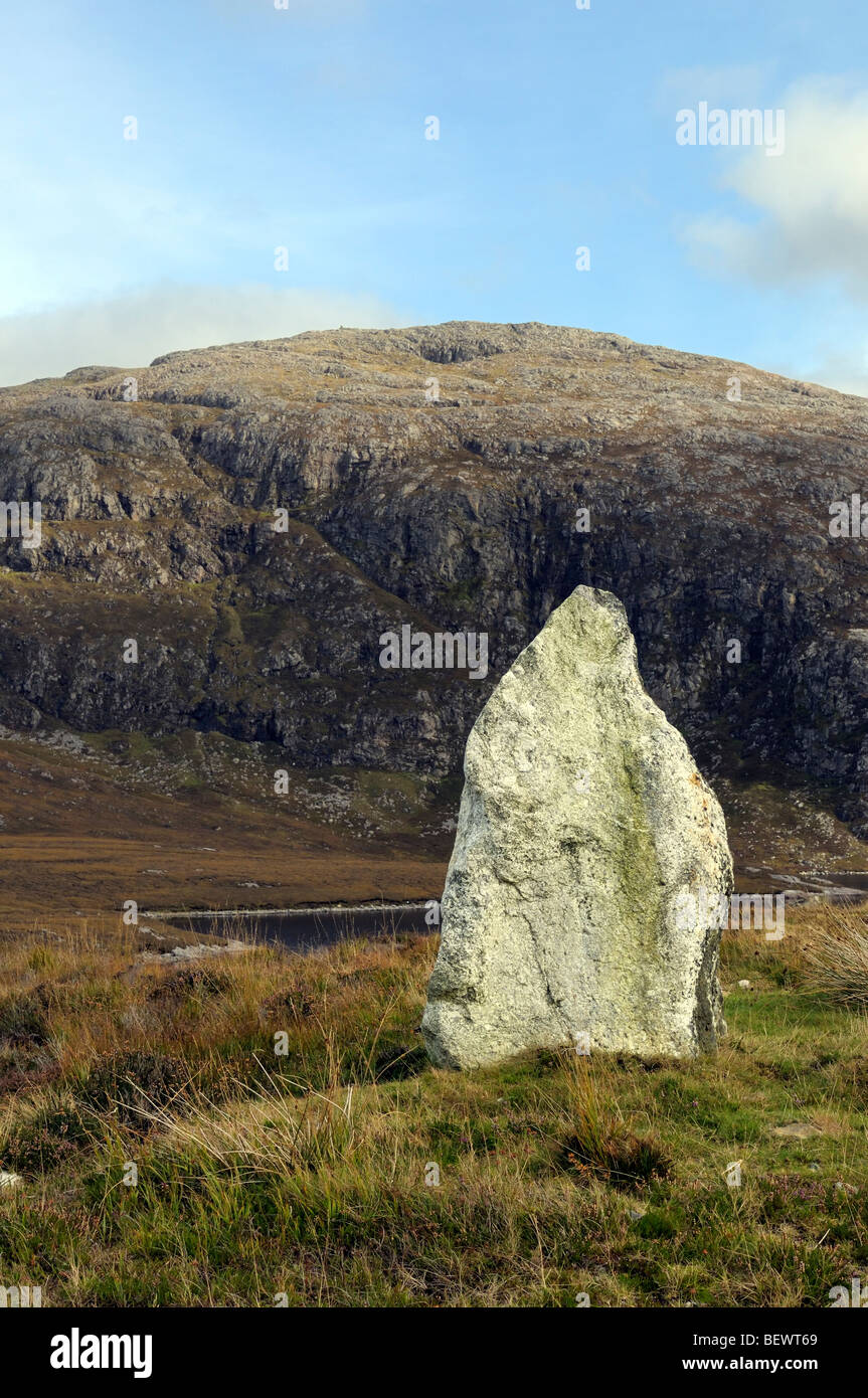 Standing stone and Mount Suainaval or Suaineabhal on the Isle of Lewis Stock Photo