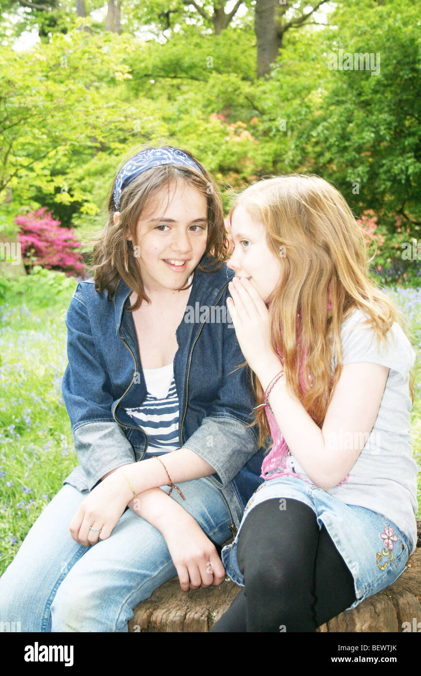 two young girl friends talking and chatting Stock Photo