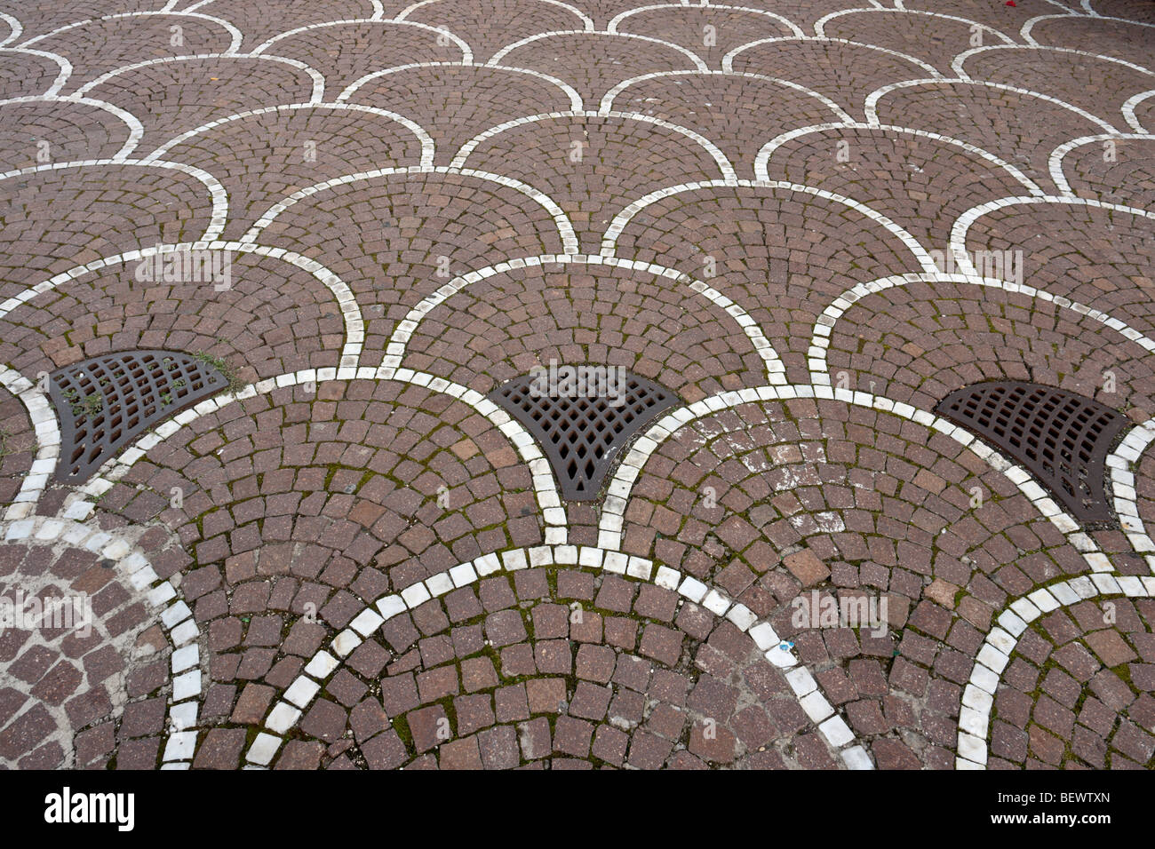 Bicolor cobble fan pattern paving on the square in front of the Palazzo dei  Congressi Stock Photo - Alamy
