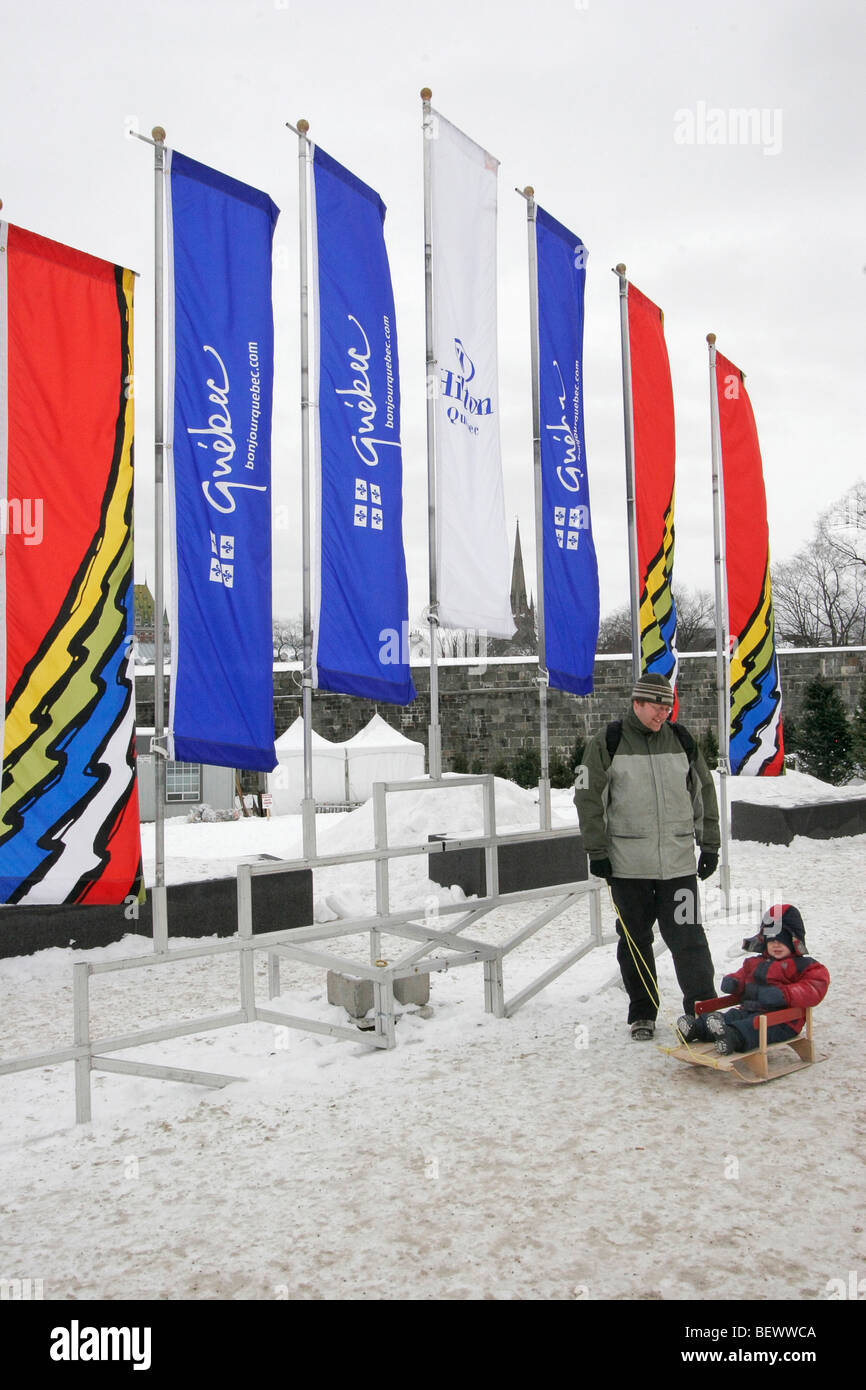 Father and daughter enjoy Quebec Winter Carnival snow play area. Quebec City, Canada. Stock Photo