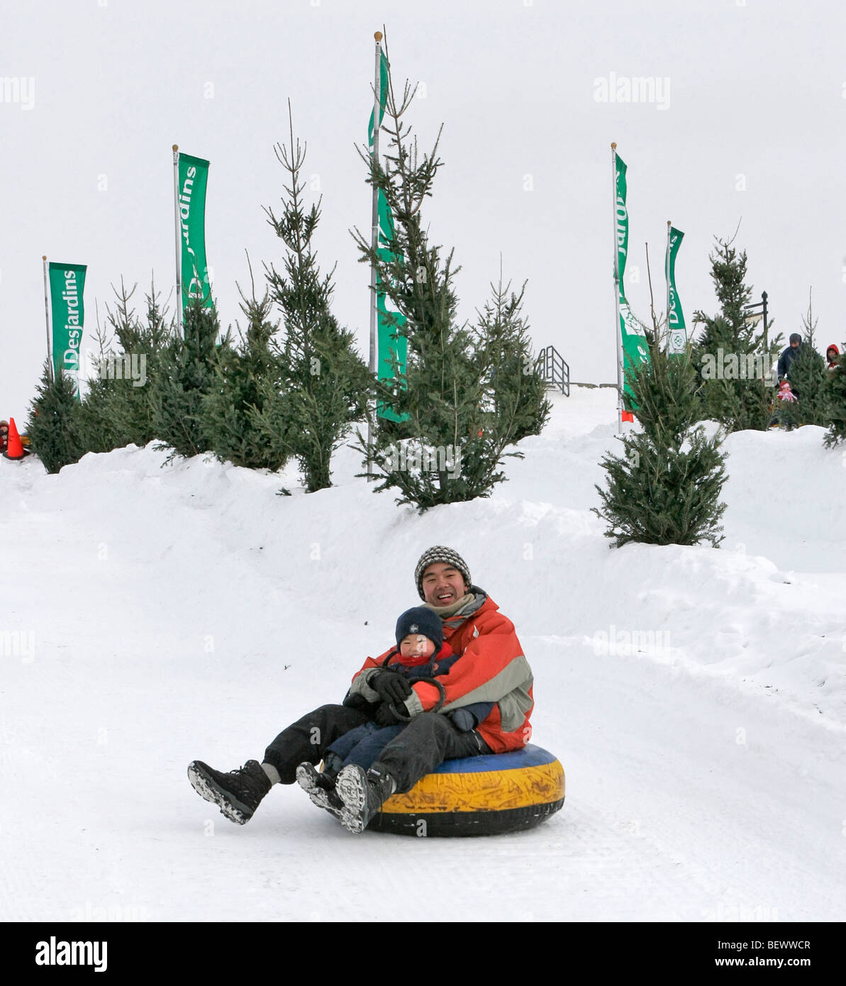Sliding down tubing run at snow play park on Plains of Abraham during Winter Carnival, Quebec