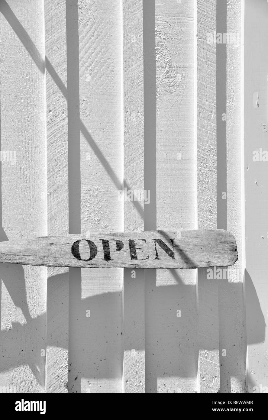 Open sign made from a wooden oar hangs outside the Marshall Point Lighthouse Museum, Port Clyde, Maine, USA. Stock Photo