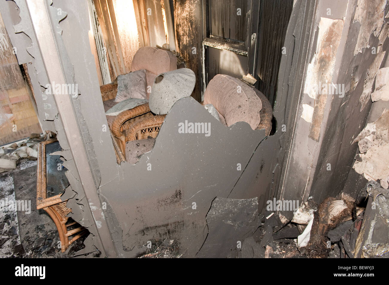 Severe house fire showing destroyed interior of house Stock Photo