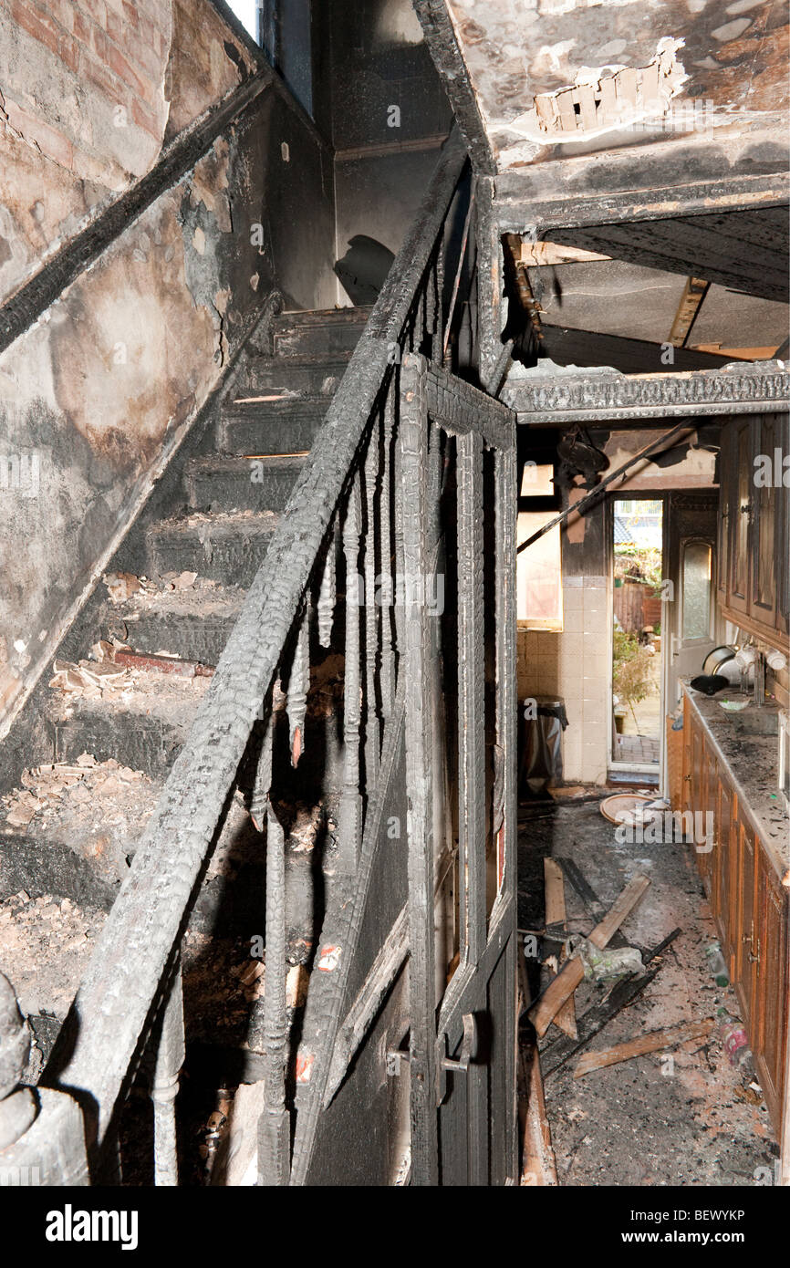 Severe house fire showing destroyed interior of house Stock Photo