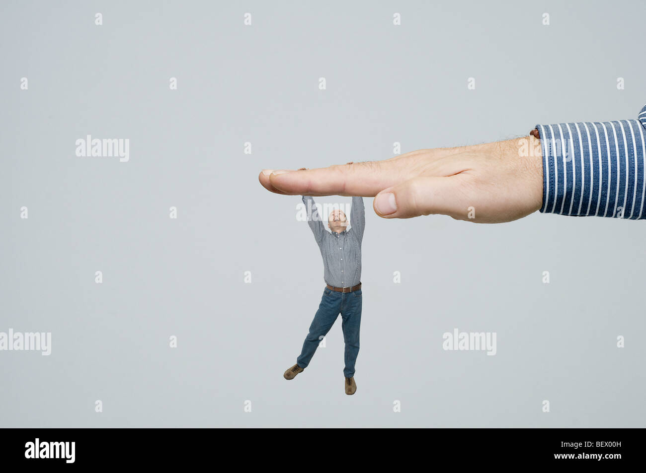 A man dangle from the hand Stock Photo