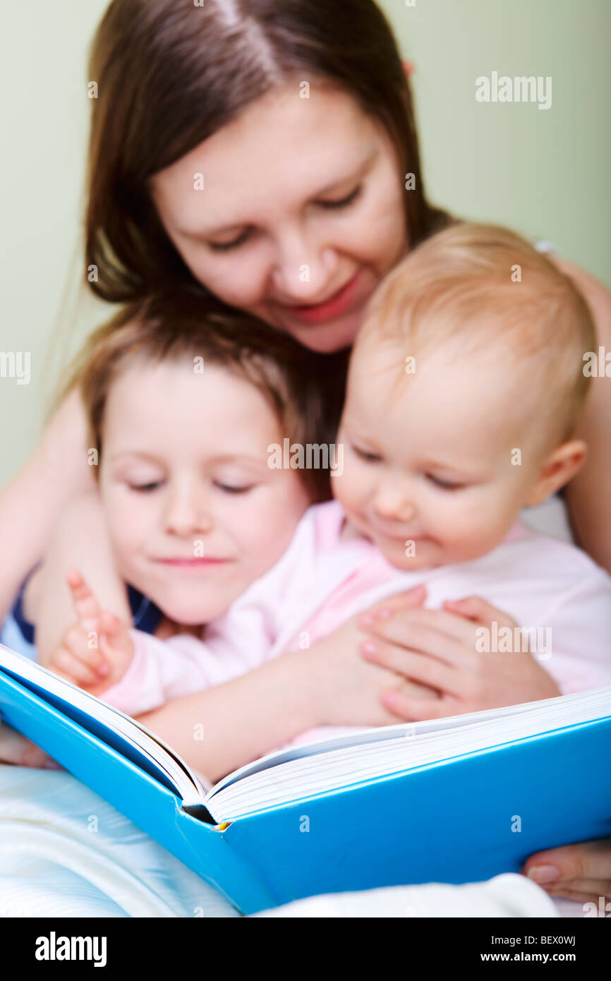 Family reading bedtime stories Stock Photo