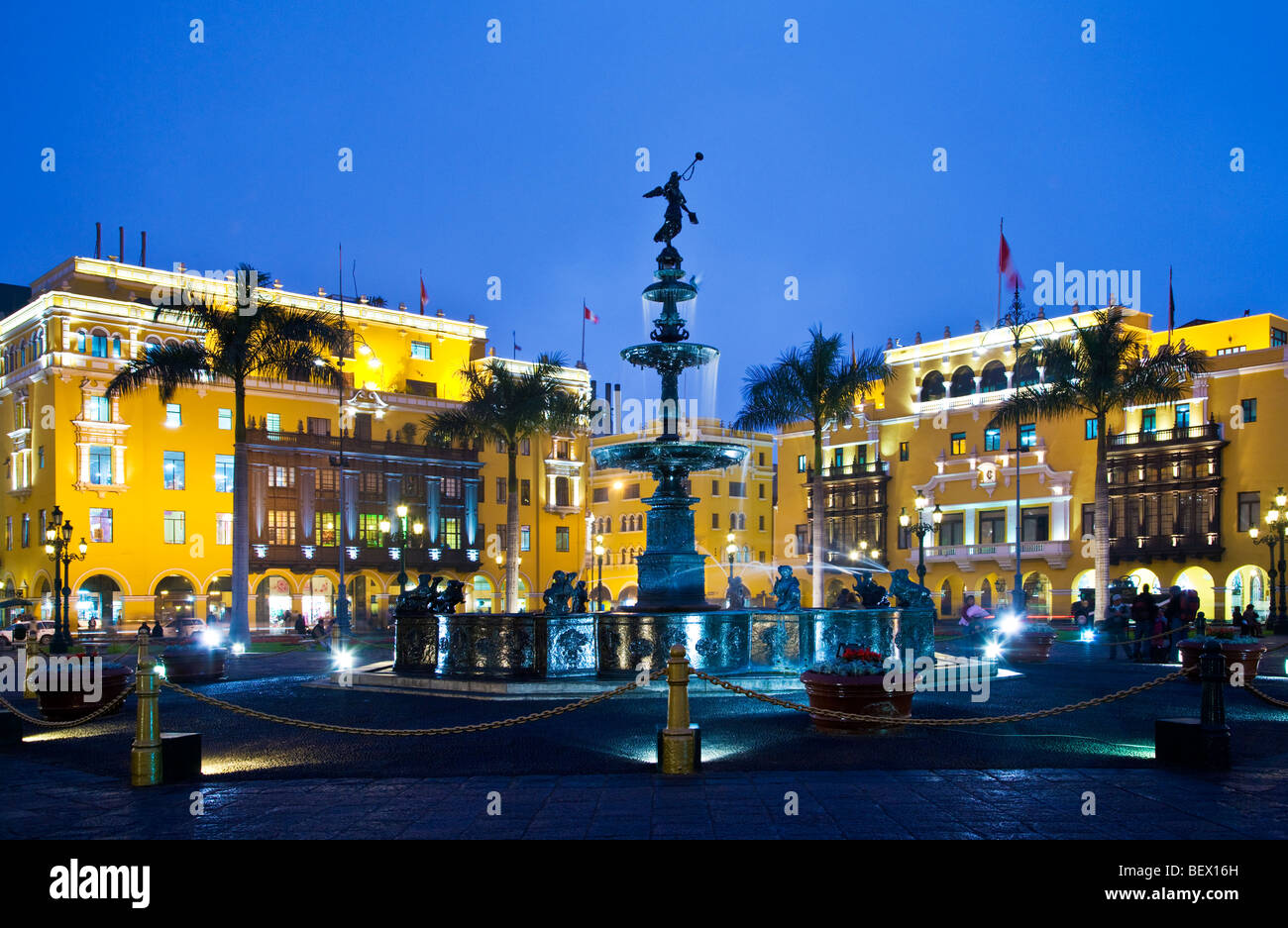 Bronze fountain, City Hall and Union Club in Plaza Mayor, formerly Plaza de Armas, in downtown Lima,capital of Peru Stock Photo