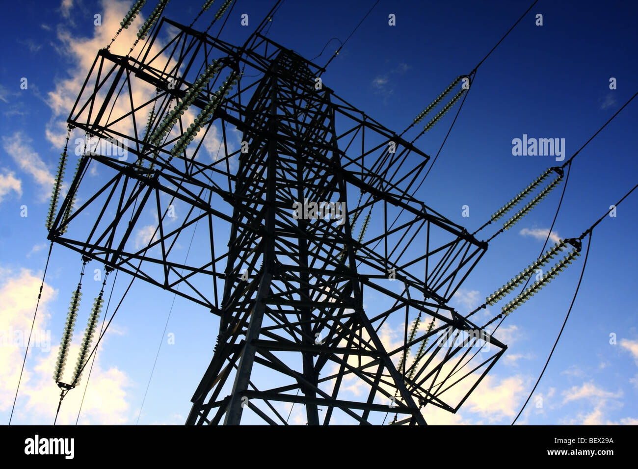 Electricity Pylon on blue sky background Stock Photo - Alamy