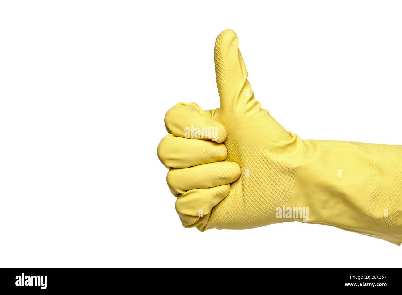 Thumbs-up with a yellow rubber glove isolated on a white background Stock Photo
