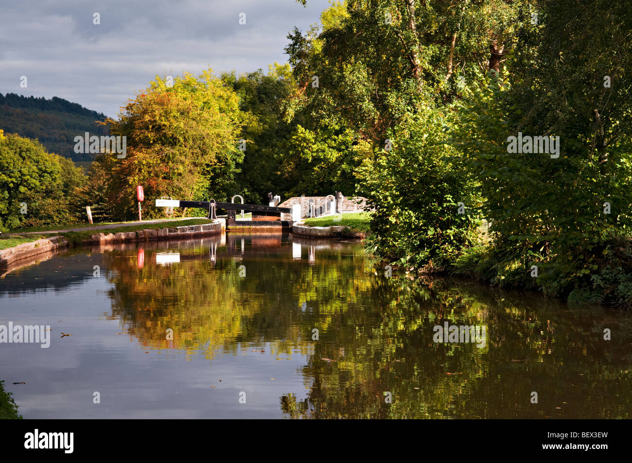 Perfect autumn reflection at Llangynidr locks, monmouth and Brecon Canal mid Wales Stock Photo