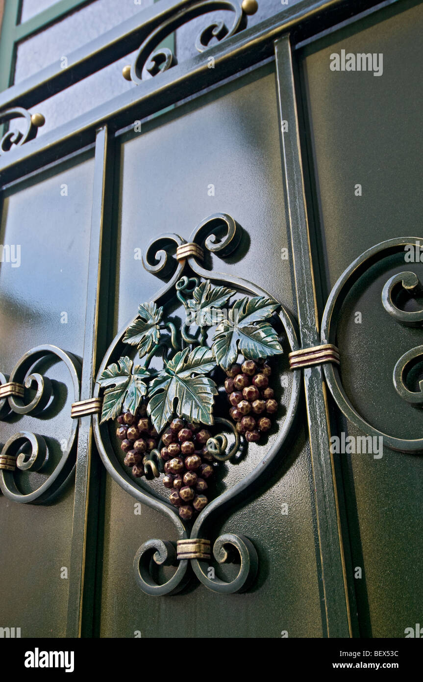 ALSACE WINERY EGUISHEIM Grape engraving motif on winemakers grand entrance gateway outside winery in Eguisheim Alsace France Stock Photo