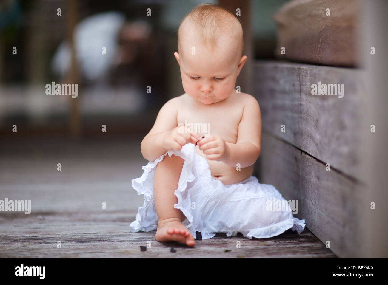 Lifestyle Portrait Of 1 Year Old Baby Girl Playing At Outdoor Terrace Stock Photo Alamy