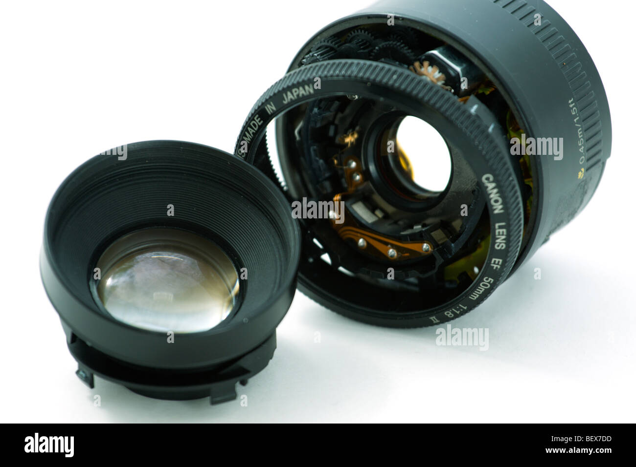 A broken camera lens on a white background Stock Photo Alamy