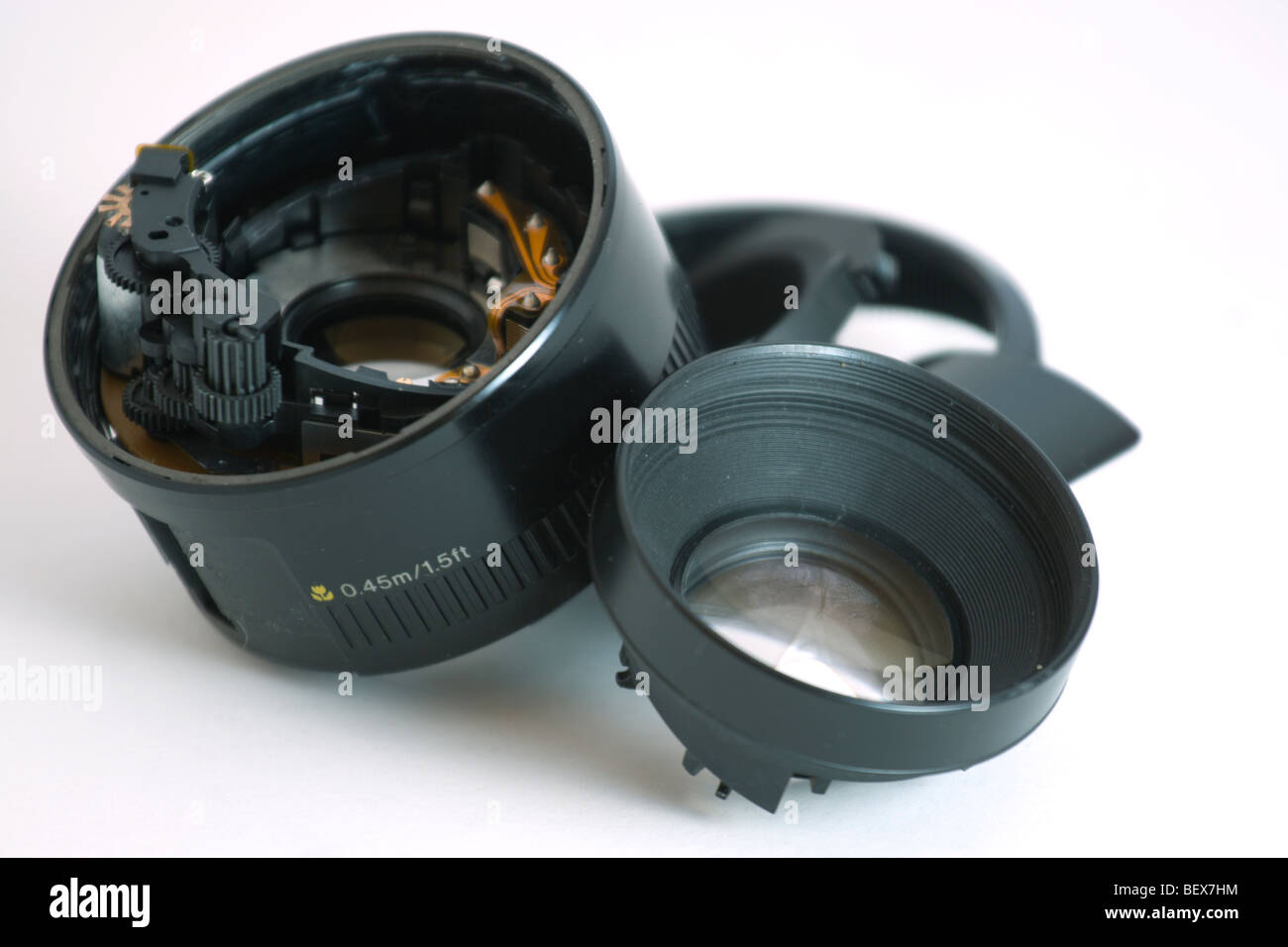 A broken camera lens on a white background Stock Photo Alamy