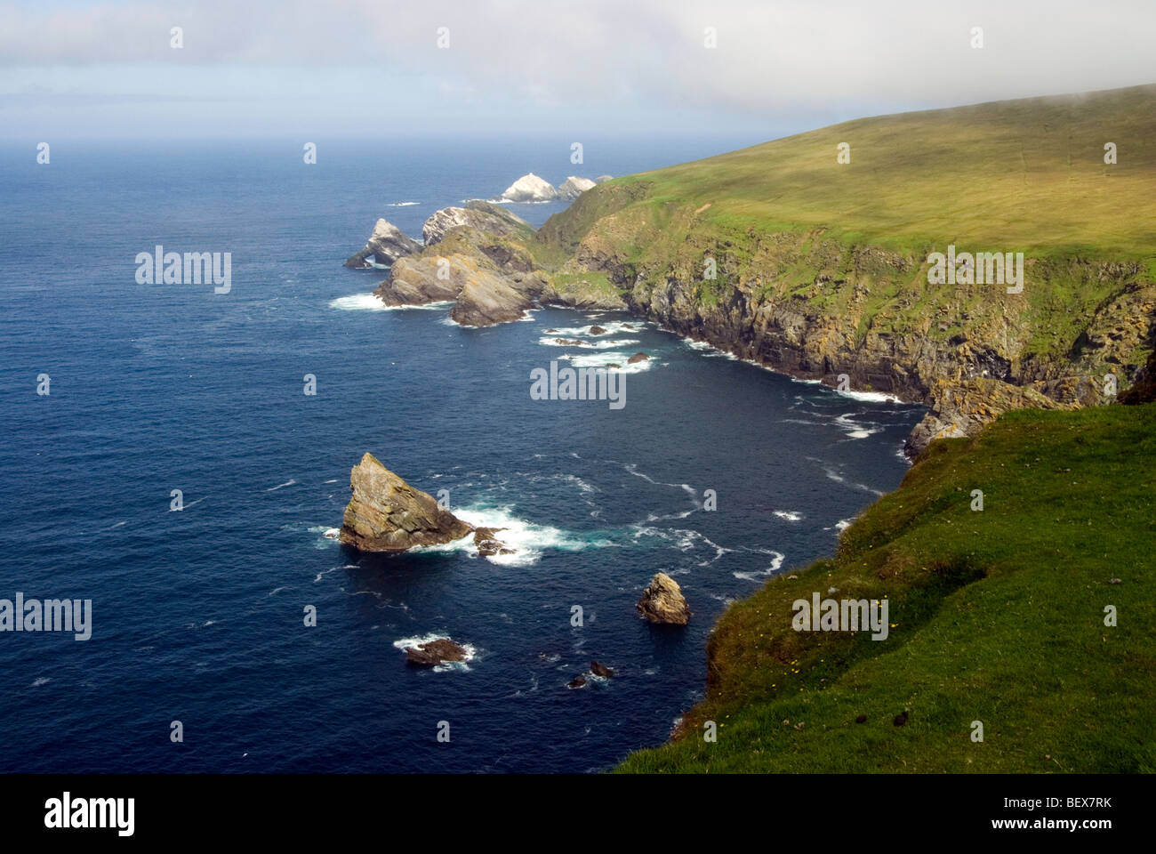 Cliffs In Hermaness National Nature Reserve Surrounded By Crystal Blue 