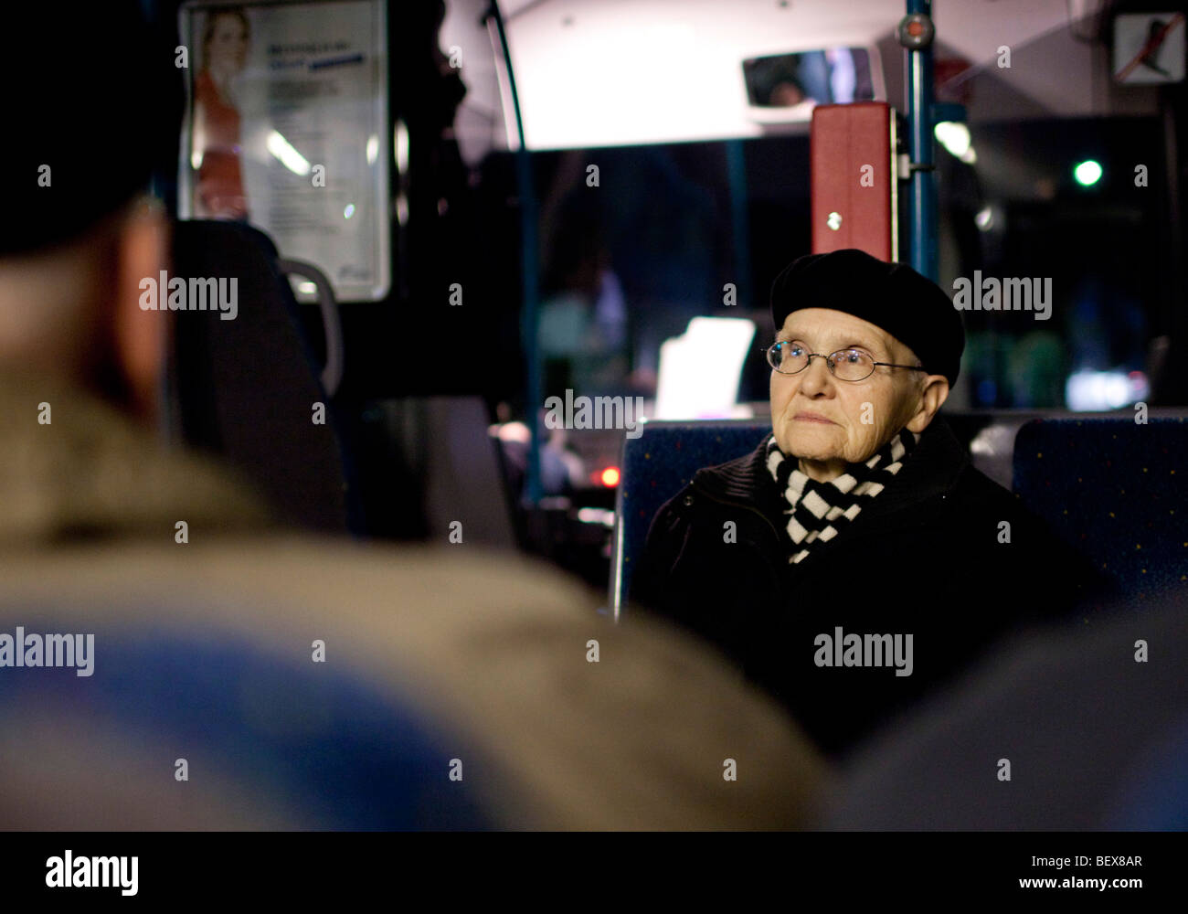 Senior in public bus . Stock Photo