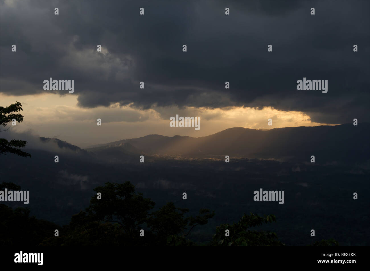 Sunlight and rays break through the clouds after a monsoon rain in the
