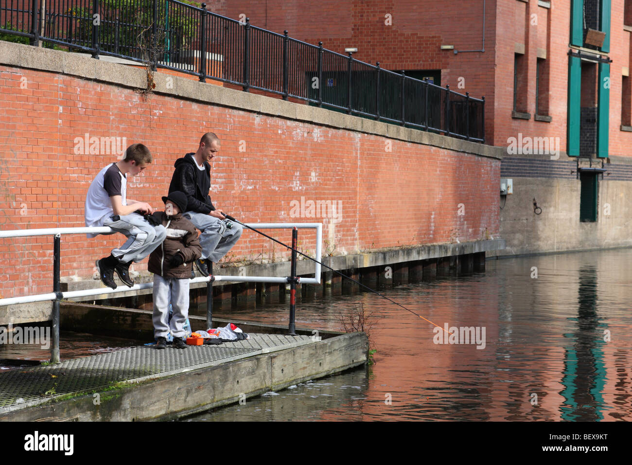Young people canal fishing in Nottingham, England, U.K. Stock Photo