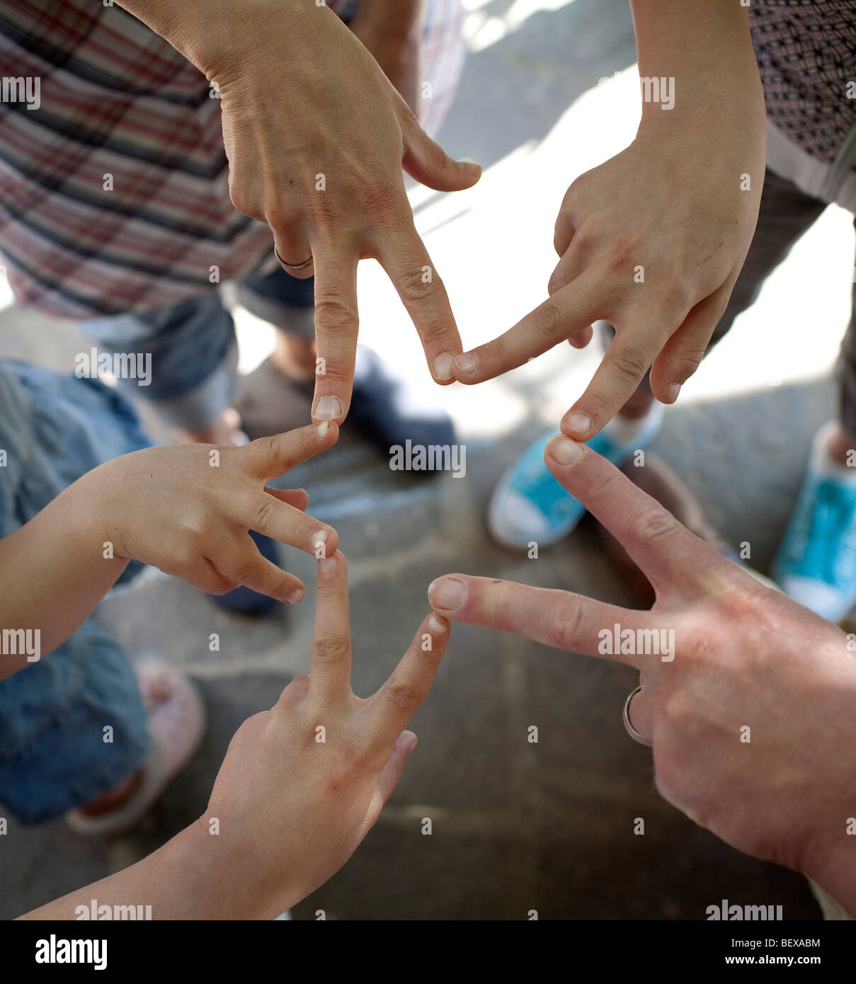 Hands of a family with three children Stock Photo