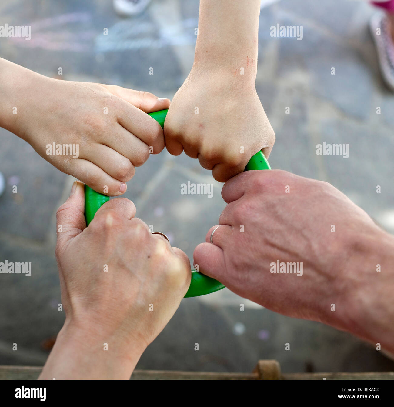 Hands of a family with three children . Stock Photo