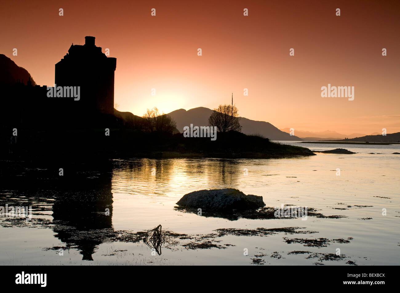 Evening light over Loch Duich and the Scottish Island Castle of Eilean Donan in Highland Region.  SCO 5428 Stock Photo