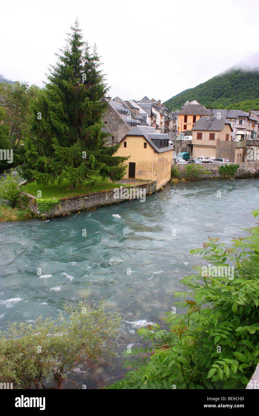 The Aure river flowing through the pretty village of Arreau in the French Pyrénées Stock Photo