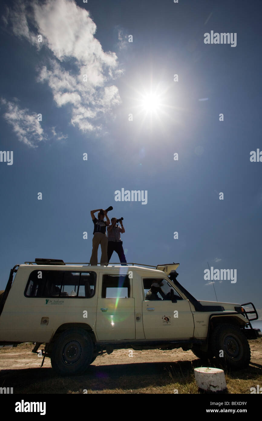 Photographers standing on safari vehicle - Lake Nakuru National Park, Kenya Stock Photo