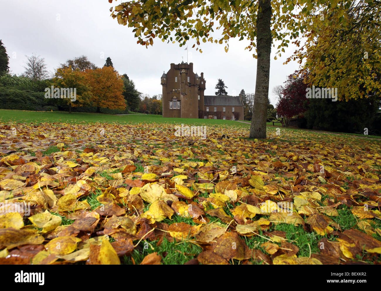 Autumnal scene with colourful leaves on the lawn at Crathes Castle, Aberdeenshire, Scotland, UK Stock Photo
