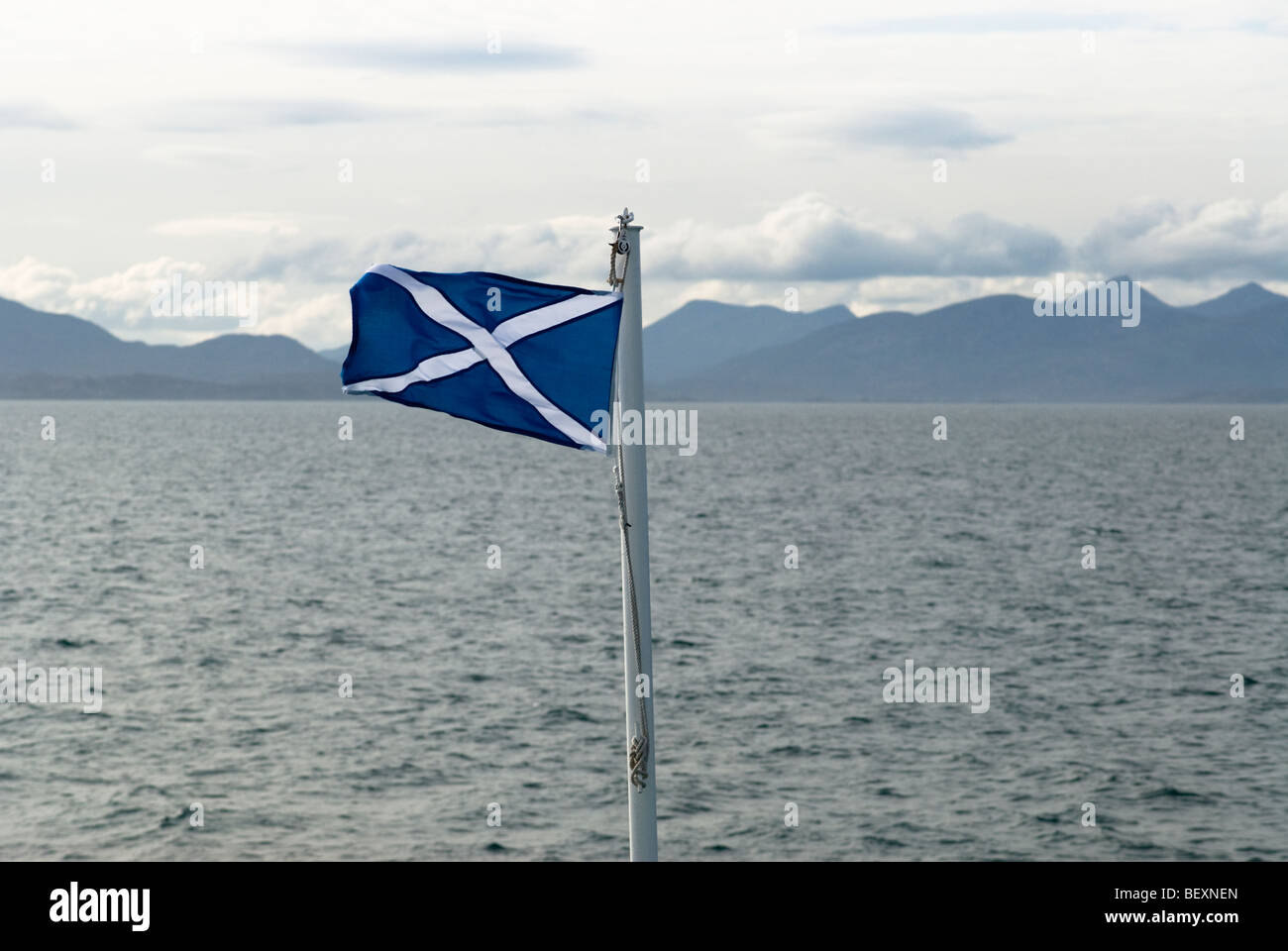 Scottish flag flying on a ship to Harris, Scotland Stock Photo