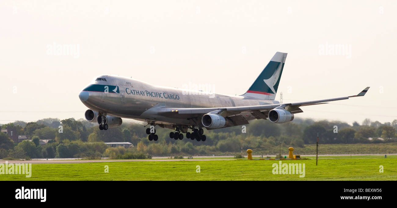 Cathay Pacific Cargo Boeing 747-400 Freighter Airliner B-HUP Touching Down on Runway at Manchester International Airport England Stock Photo