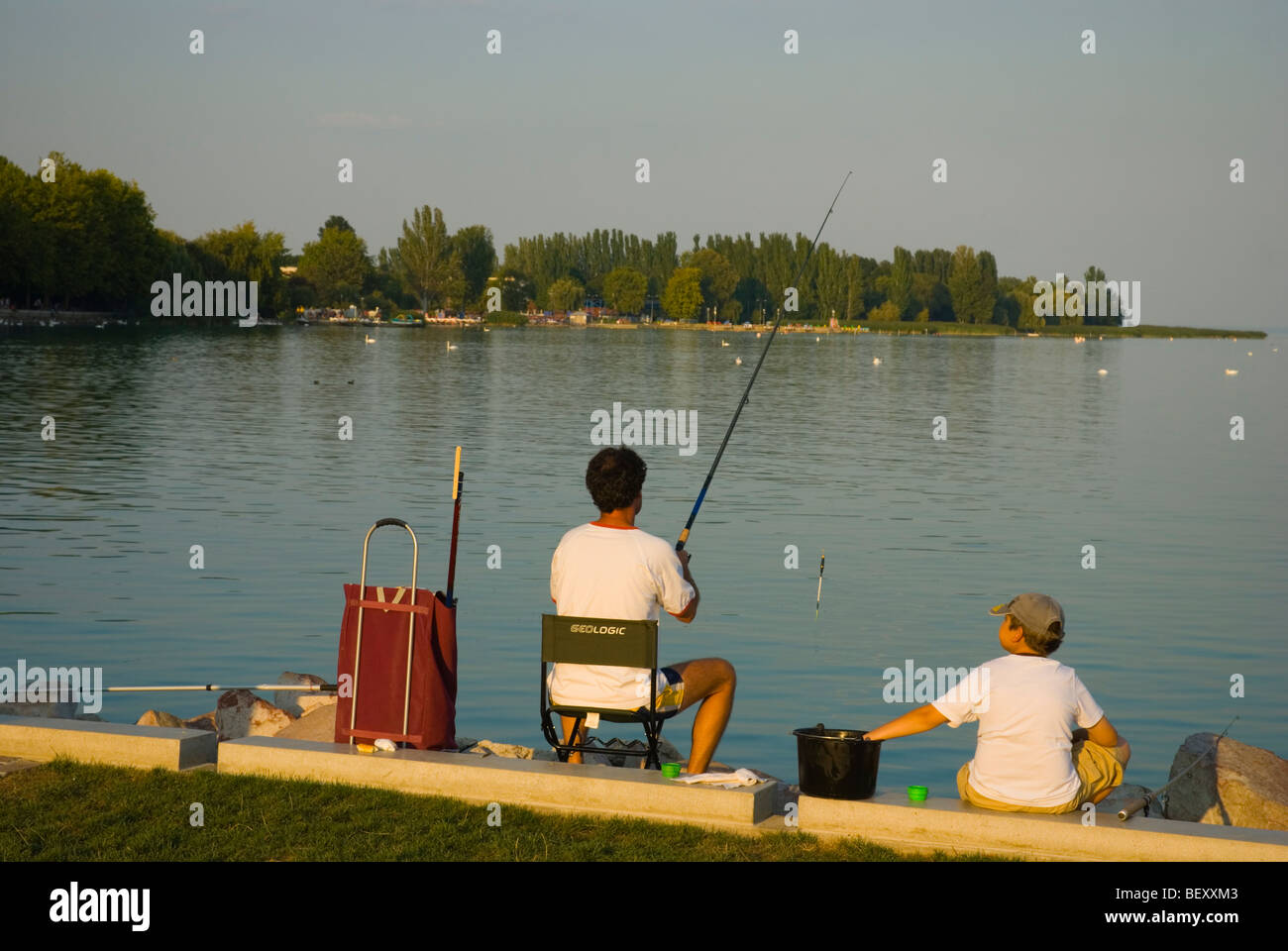 Father and son fishing by Lake Balaton Balatonfüred Hungary Europe ...