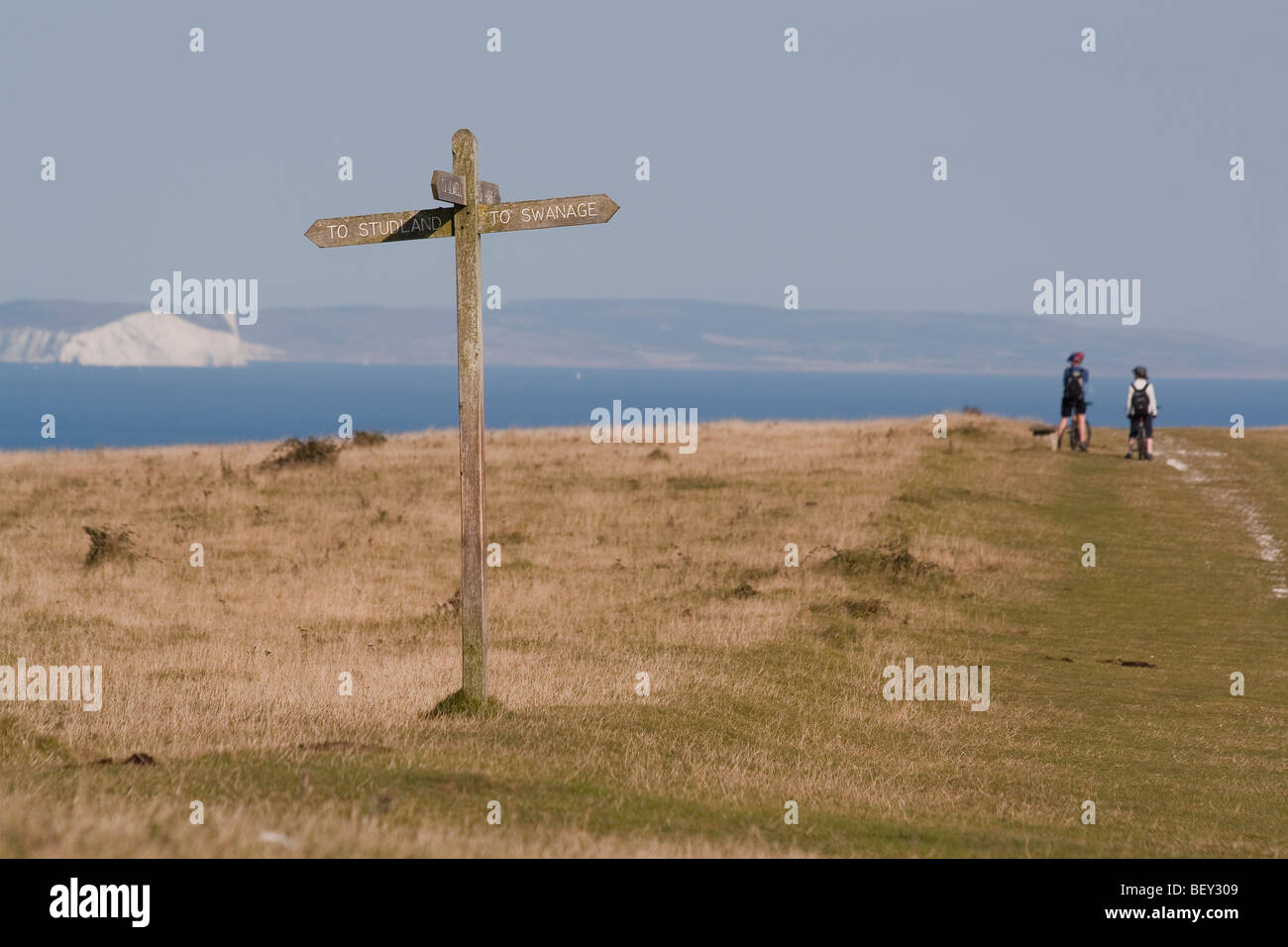 A signpost on Ballard Down points the way to Studland and Swanage, Dorset, UK Stock Photo
