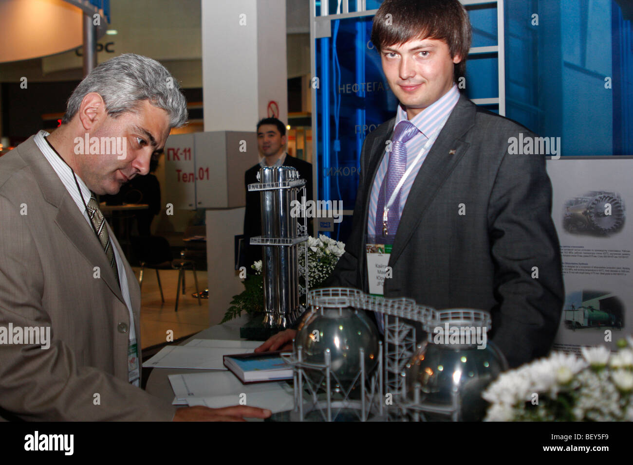 Visitor 'checks in' at exhibition booth of a company during KIOGE oil and gas exhibition in Almaty, Kazakhstan Stock Photo