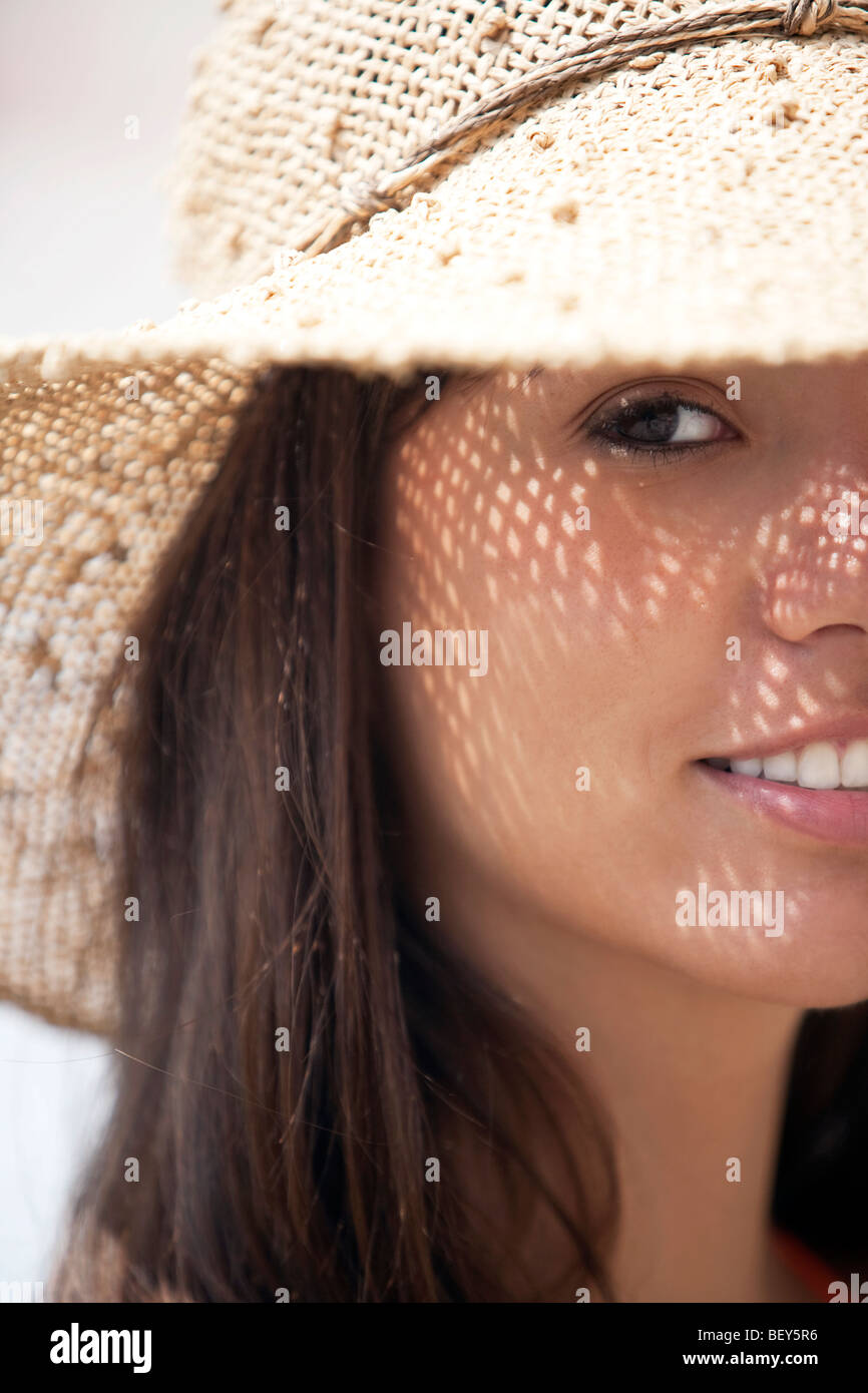 portrait of young woman wearing a straw hat Stock Photo - Alamy