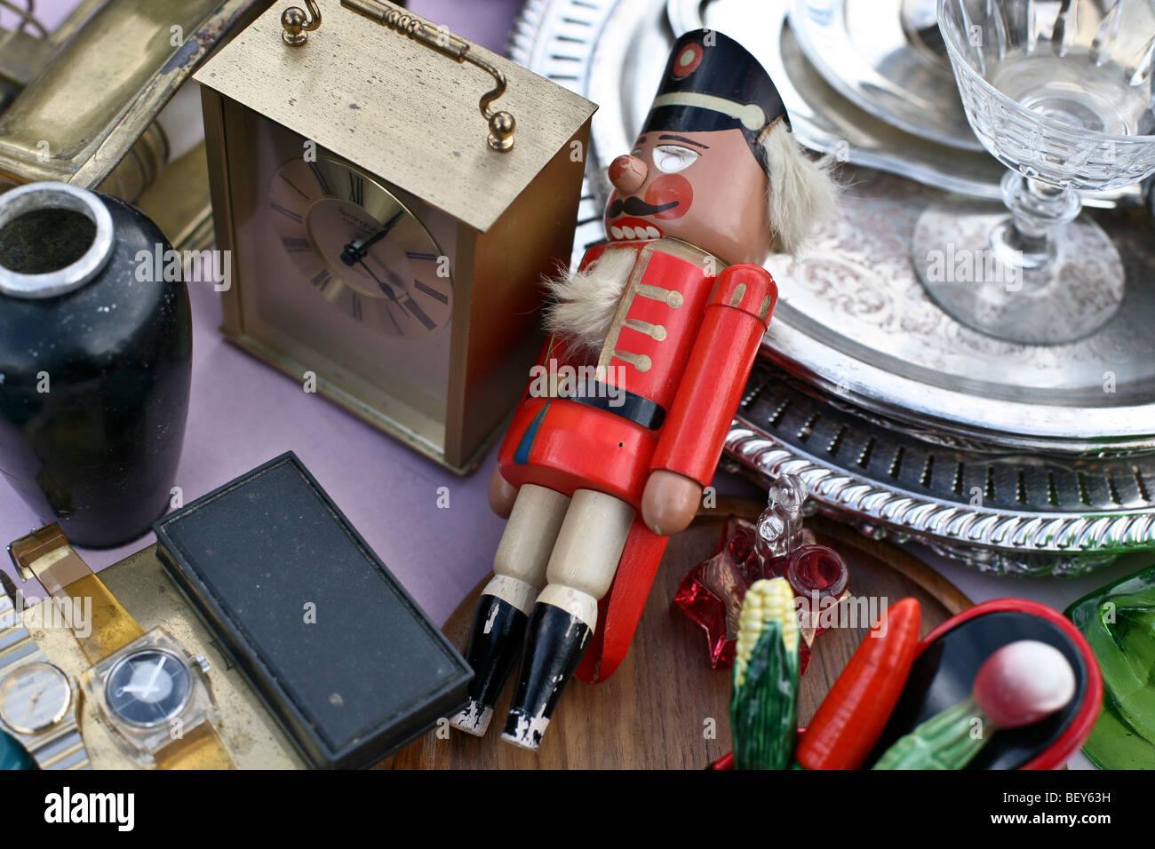 classic painted wooden toy soldier at attention among other treasures displayed for sale at Hells Kitchen flea market on 39th St Stock Photo