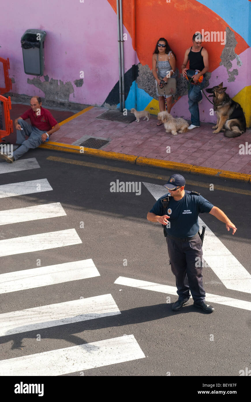 Police man regulating the traffic flow coming from the Armas ferry in the harbor of Santa Cruz de Tenerife Stock Photo