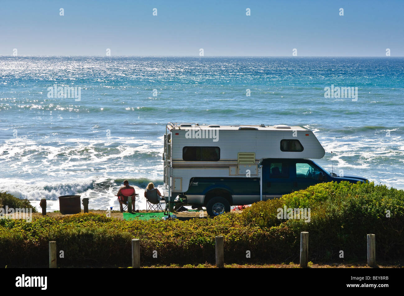 Couple and RV motorhome along the Northern California coastline near Mendocino. Stock Photo
