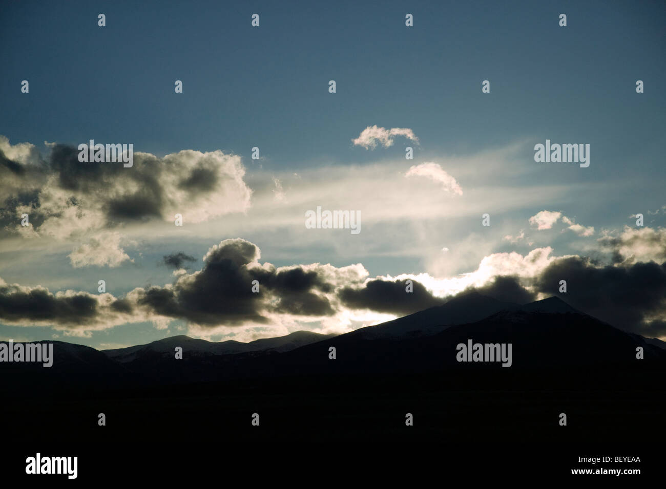 Dramatic backlit clouds over the Rocky Mountain peaks near Salida, Colorado, USA Stock Photo
