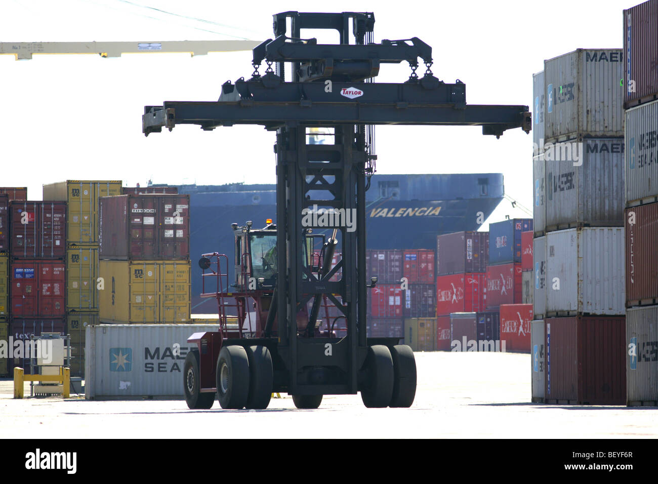 Loading containership in port Stock Photo - Alamy