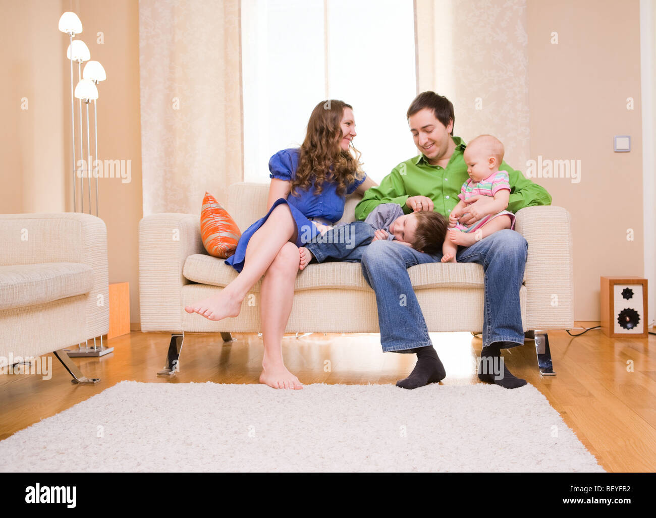 Young family of four hi-res stock photography and images - Alamy