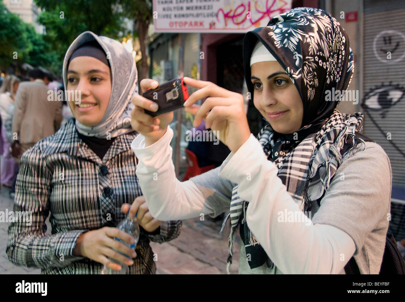 Istanbul Turkey Camera Woman kerchief  turban scarf Stock Photo