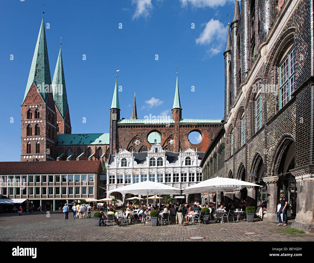 People at pavement bar outside the town hall Lubeck Germany Stock Photo