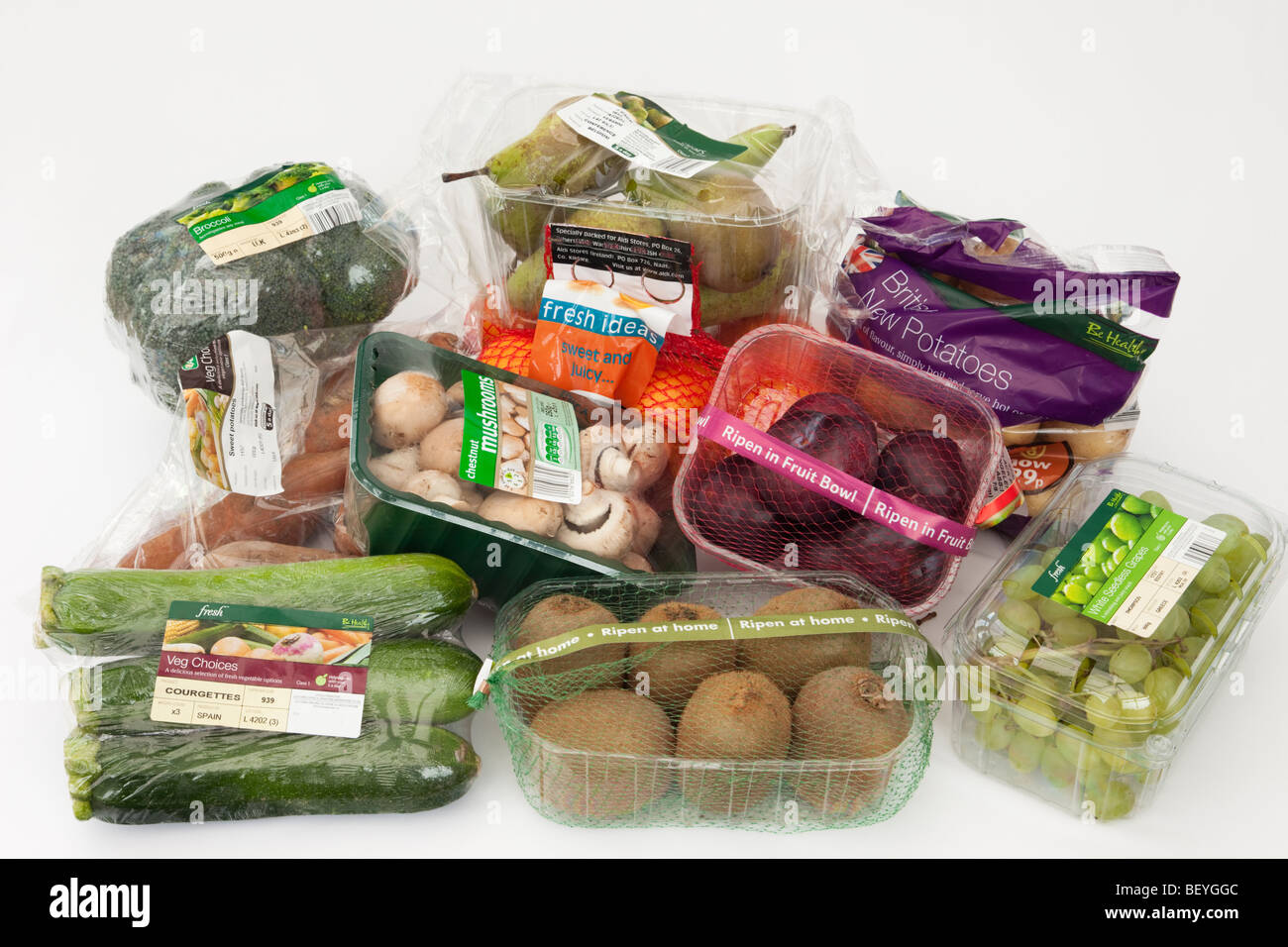 Selection of fruit and vegetables in packaged single-use plastic packaging from a supermarket. England UK Britain Stock Photo