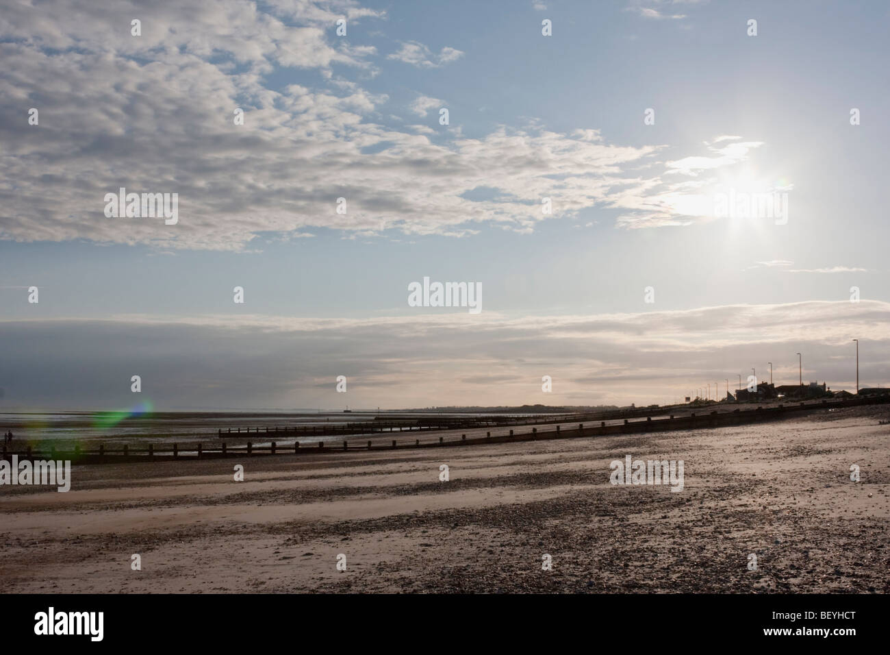 Empty beach and strong sunshine in Littlehampton, West Sussex. Stock Photo