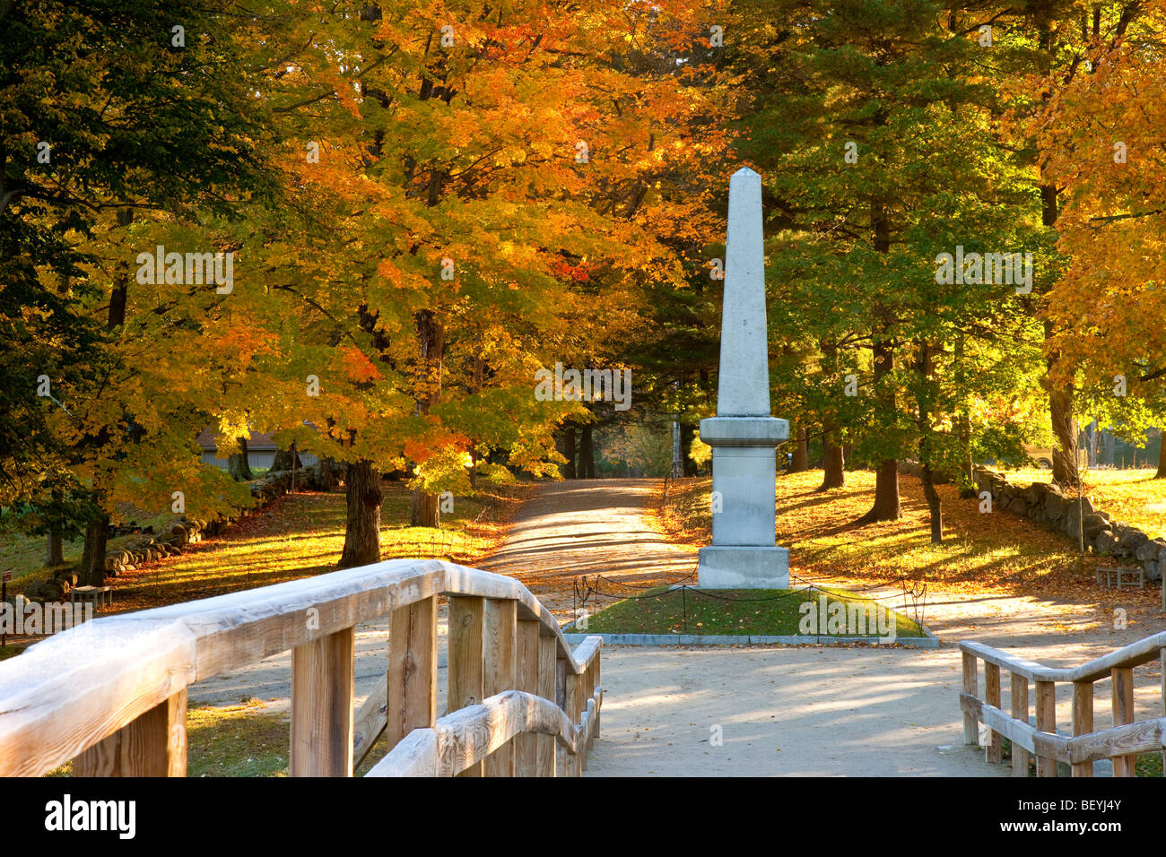 Autumn view from historic Old North Bridge of Monument and tree-lined walk-way, Concord Massachusetts USA Stock Photo