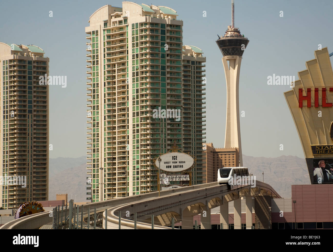 The high level monorail train glides between high rise buildings in Las Vegas, USA. Stock Photo