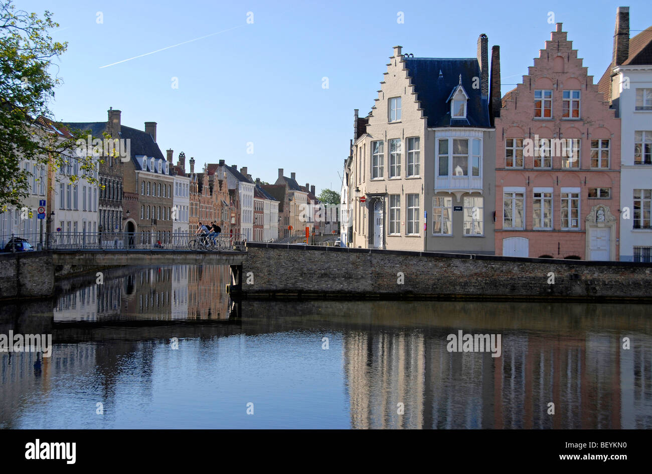 Facades of buildings on canal along Sint Annarei and Spinolarei Bruges Brugge Belgium Stock Photo