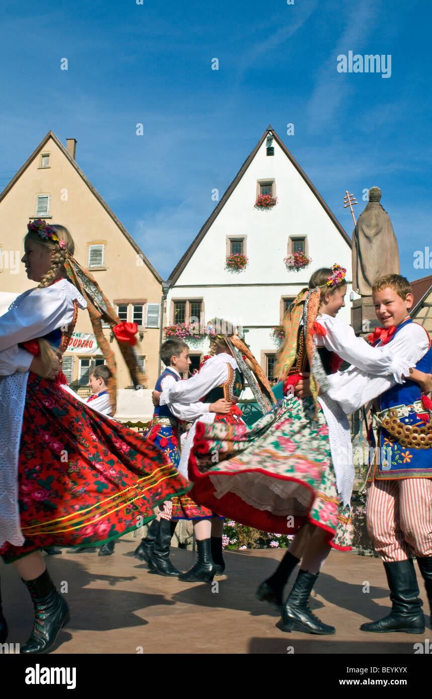 'Fete du Vin Nouveau'  dancers in traditional costume celebrate the 'Fete du Vin Nouveau' at Eguisheim Alsace France Stock Photo