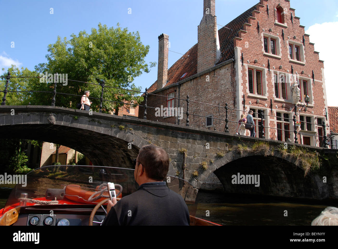 Canal boat tourguide, Bruges, Brugge, Belgium Stock Photo